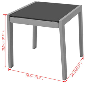 Schwarze Sonnenliegen mit Tisch