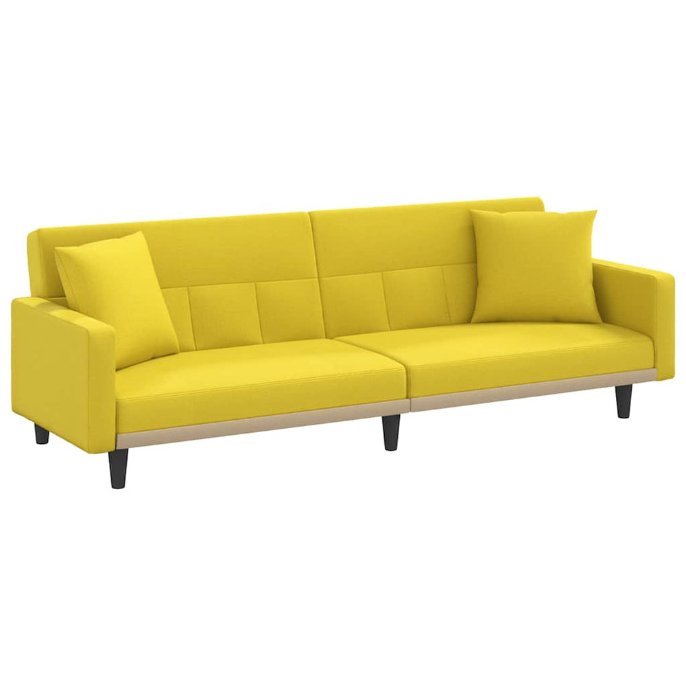Hellgelbes Schlafsofa mit Kissen
