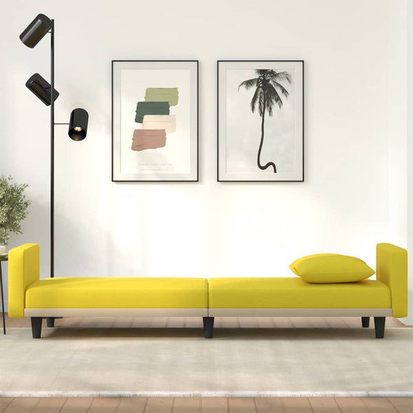 Hellgelbes Schlafsofa mit Kissen