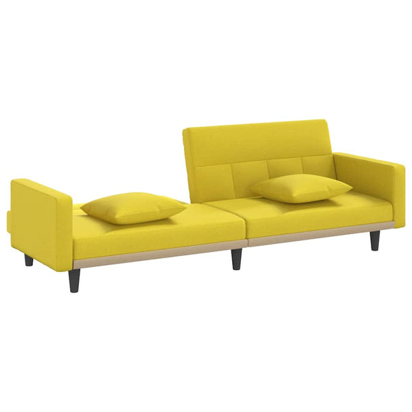 Hellgelbes Schlafsofa mit Kissen