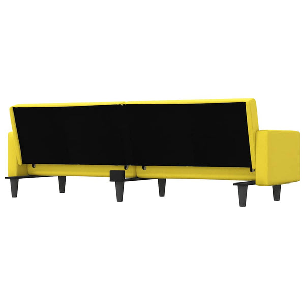 Hellgelbes Schlafsofa mit Kissen