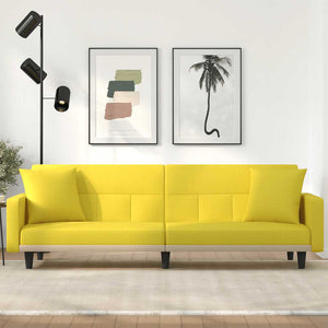Hellgelbes Schlafsofa mit Kissen