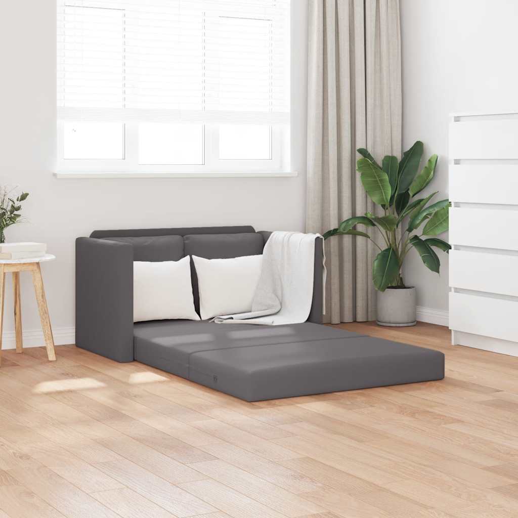 Graues Bodensofa mit Schlaffunktion