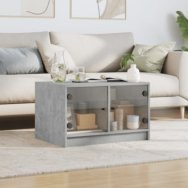 Betongrauer Couchtisch mit Glastüren