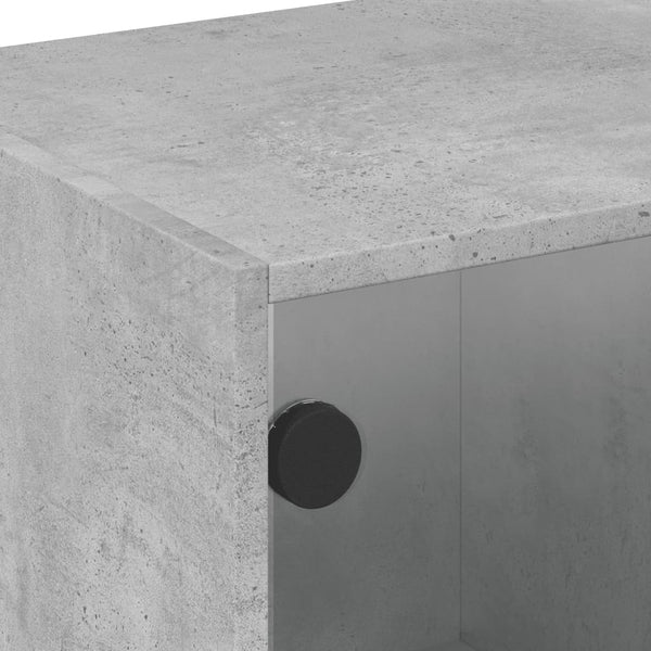 Betongrauer Couchtisch mit Glastüren