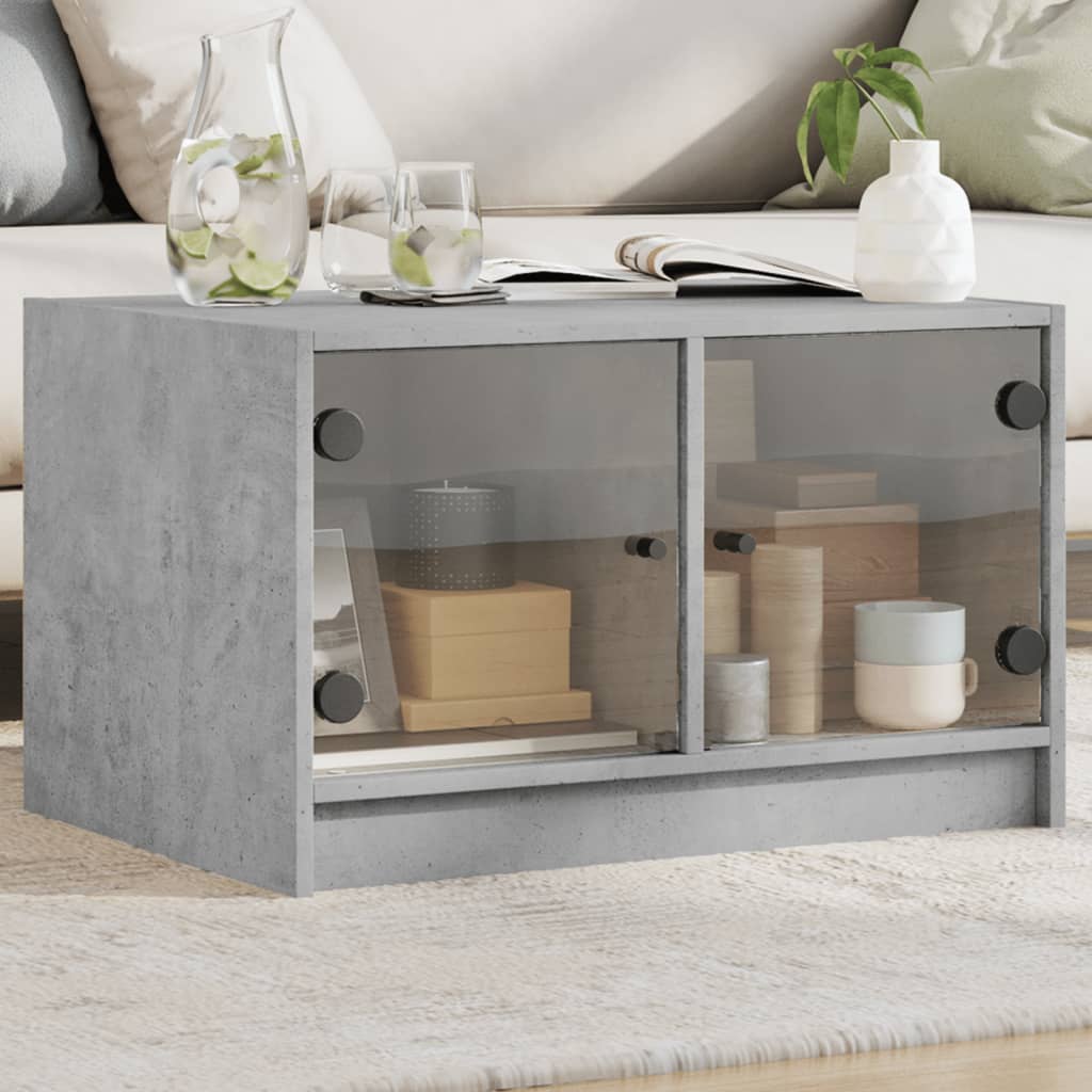 Betongrauer Couchtisch mit Glastüren