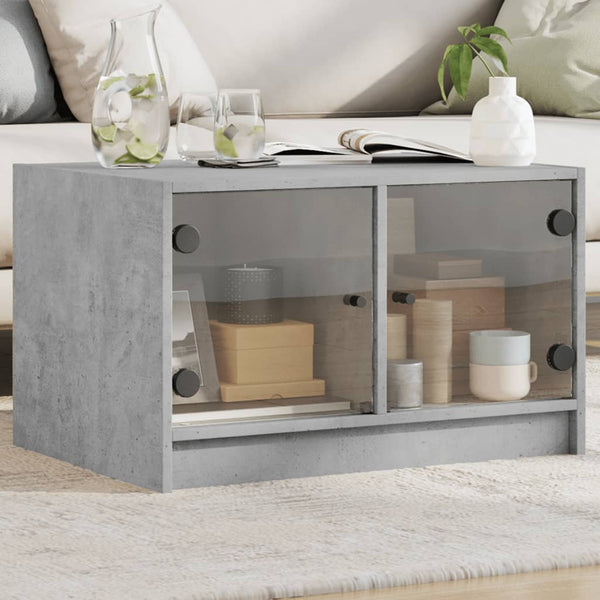 Betongrauer Couchtisch mit Glastüren