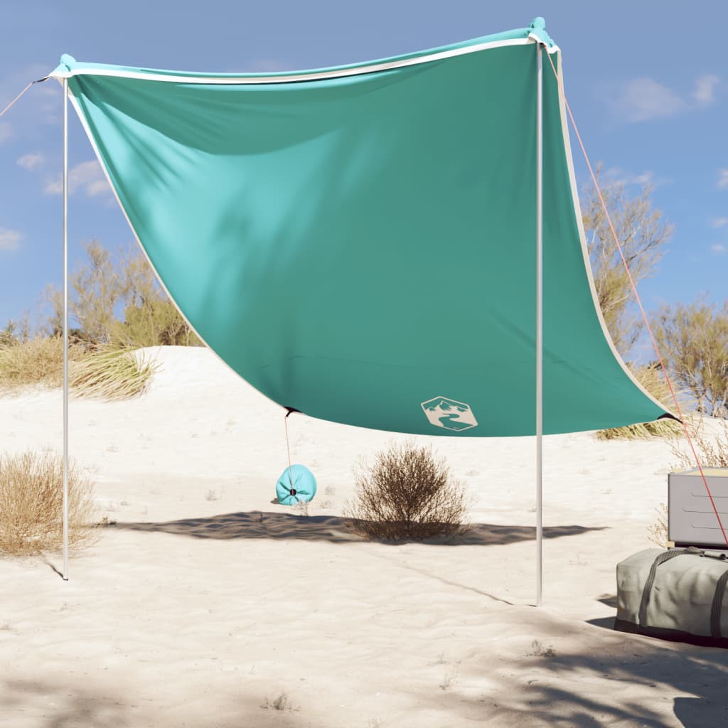 Grünes Strand-Schattenzelt mit Sandsäcken